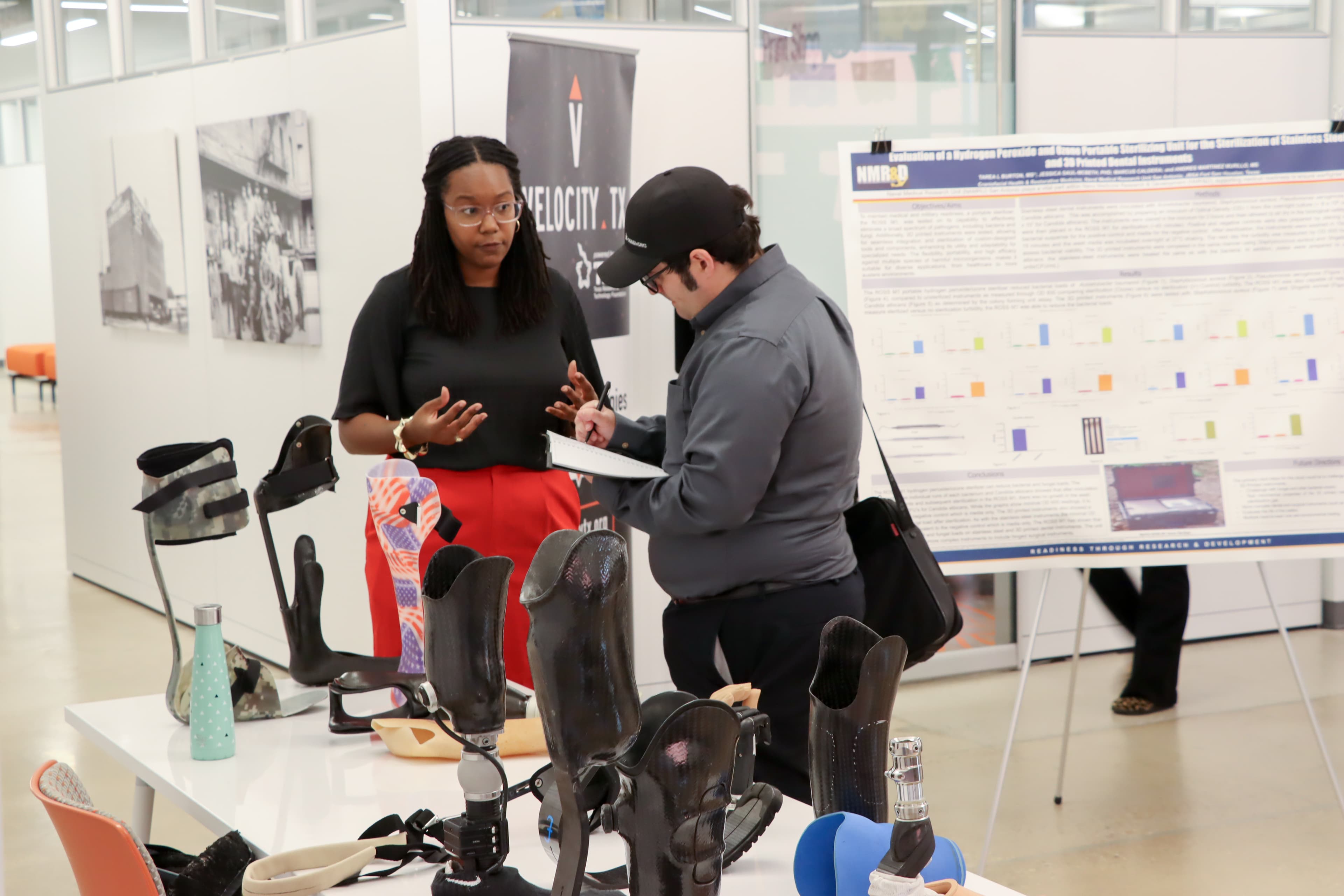 Researcher presenting prosthetics innovations at ProPEL