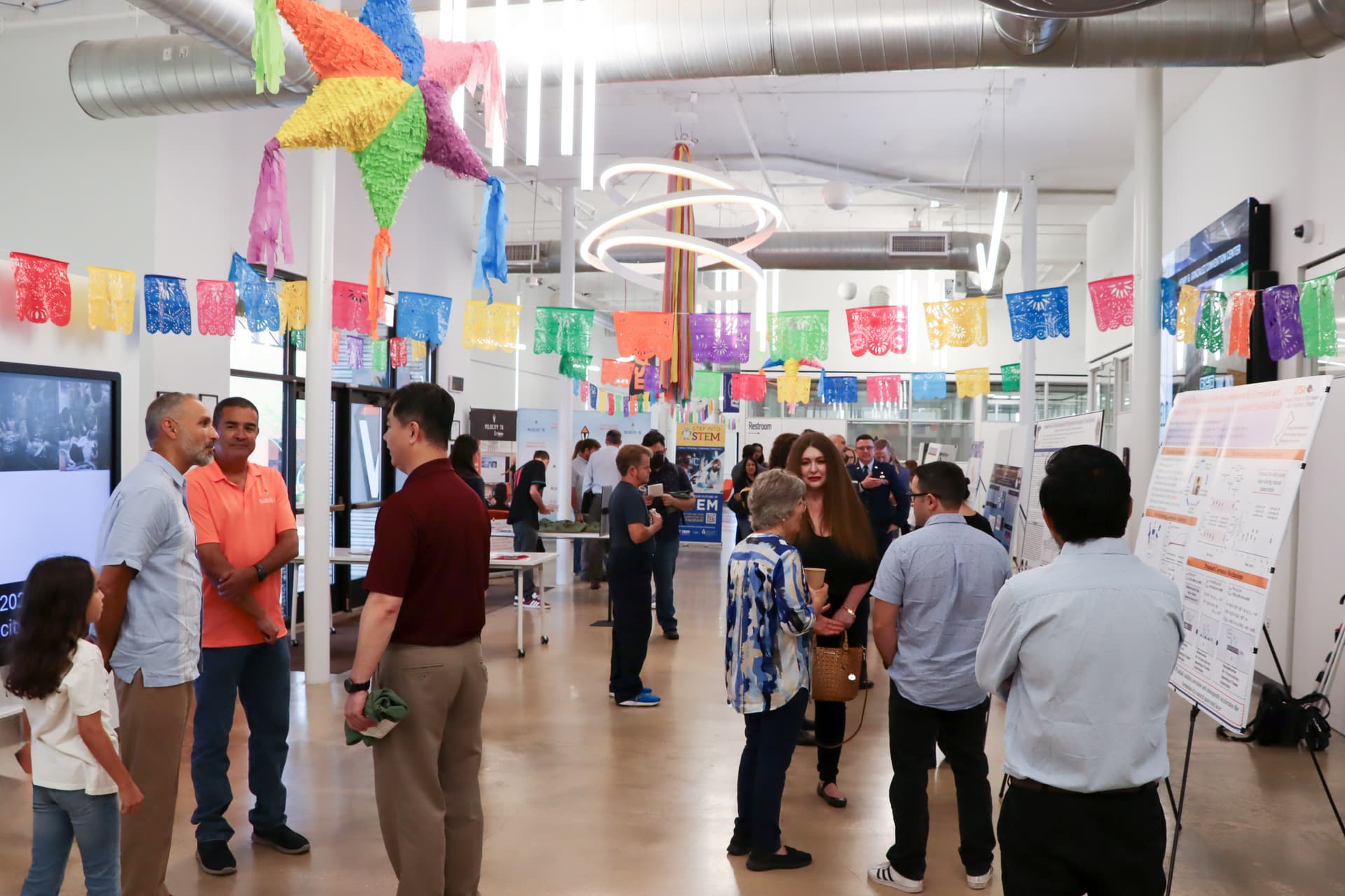 ProPEL research symposium at VelocityTX – attendees networking and viewing poster presentations